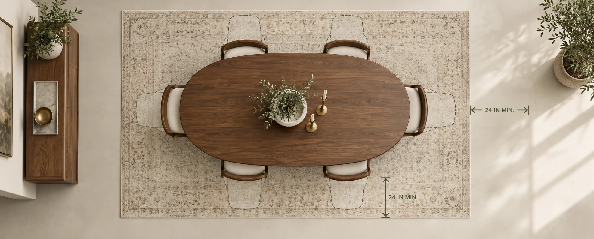 Dining room with a walnut table on a pale rug, arrows marking the 24 inch minimum of rug beyond the table edge on each side.