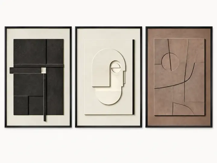 Relief blocks in black, cream and clay, paper cut relief, black frames.