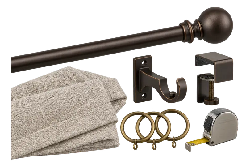 A curtain set laid out: a bronze rod with a ball finial, a folded stack of cream linen panels, a wall bracket, a clamp on bracket for a window frame, three brass rings and a tape measure.