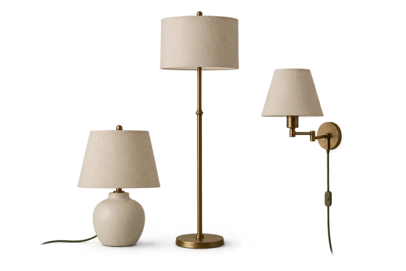 The three lamp shapes side by side: a short ceramic table lamp with a tapered linen shade, a tall brass floor lamp with a drum shade, and a plug-in wall sconce on a swing arm with its cord hanging.