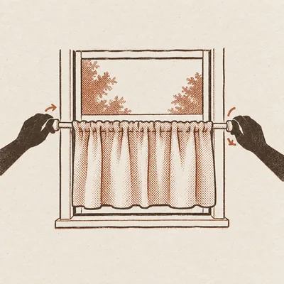 Two hands twisting the ends of a tension rod into a window frame, a half-height curtain already gathered on the rod with trees visible through the glass above it.