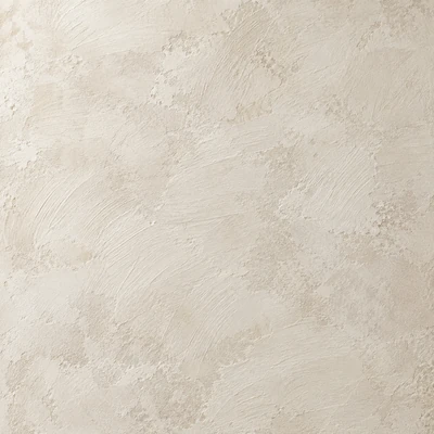 The same limewash after four years: cloudy brushwork still there, one corner rubbed thin, a hairline crack, a leaning mark.