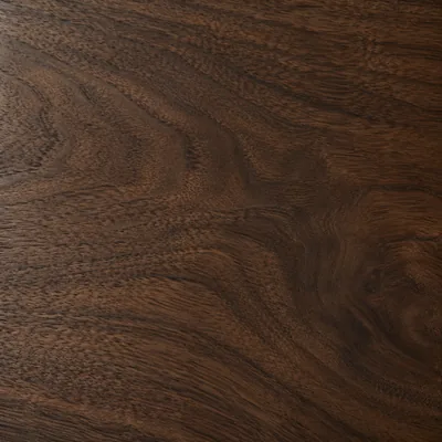 New walnut up close: straight dark grain under an even satin finish.